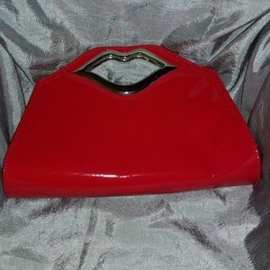 Lip handled clutch/purse